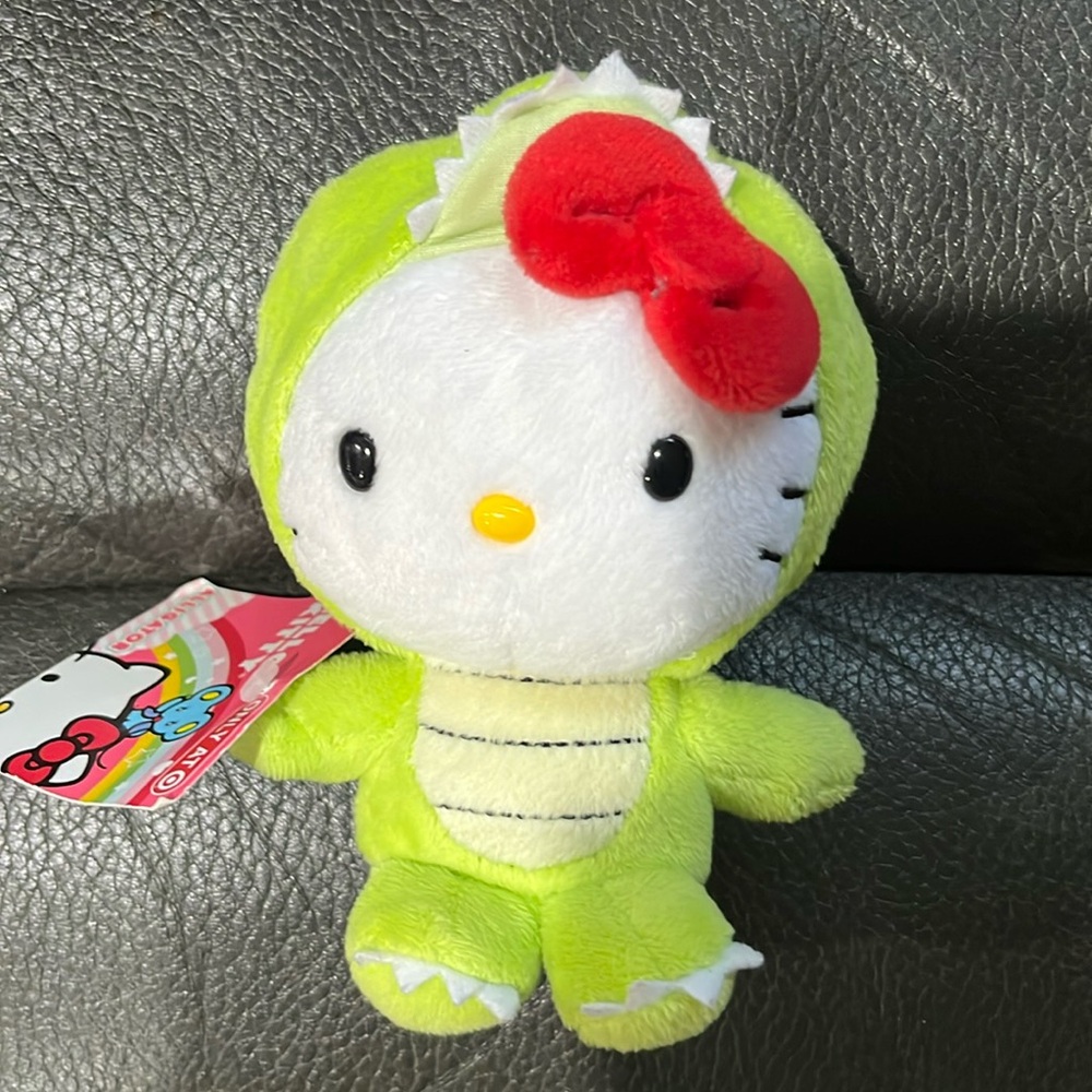 Hello kitty in alligator costumes